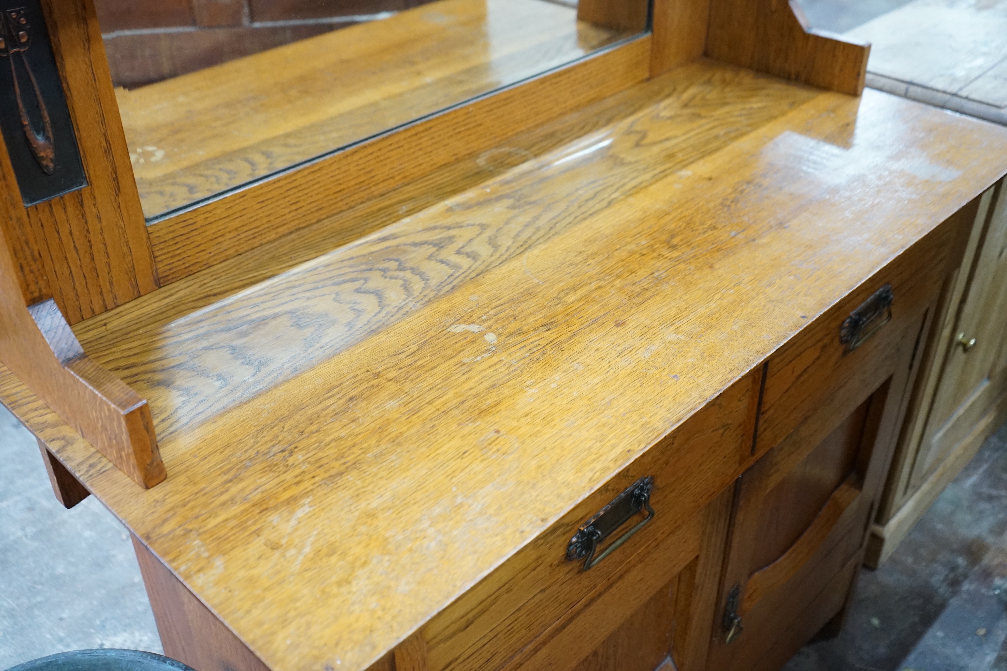 An Art Nouveau oak mirror back sideboard, length 122cm, depth 55cm, height 145cm